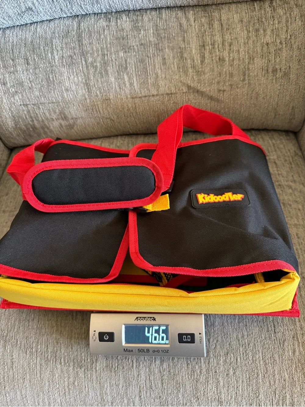 Kids travel activity organizer features a fold-out flat play surface. See detail